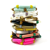 Stack of colorful bangles on a white background