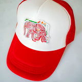 Red and white cap with an embroidered elephant design on a light gray background