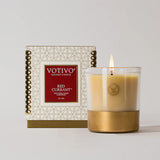 Votivo Red Currant candle with packaging on a light gray background