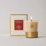 Votivo Red Currant candle with packaging on a light gray background