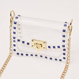 White handbag with gold chain and blue accents on a white background