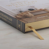 Book with a bookmark on a marble surface