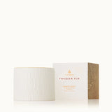 Fragranced candle with packaging labeled 'Frasier Fir' on a white background