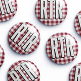 Several round pin-back buttons with a red and white gingham pattern and the letters 'RTR' in bold white with black outlines, arranged on a white background.