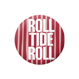 A circular button or badge featuring a red and white striped pattern with the text 'ROLL TIDE ROLL' in bold white letters.
