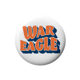 A round white button badge featuring the words 'WAR EAGLE' in orange letters with a dark blue shadow effect, centered on a plain white background.