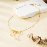 Gold Necklace with Large Bow Tie and Pearls on Tips