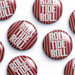 Multiple round pin-back buttons with a glossy finish, featuring a red and white striped candy cane design with the text 'ROLL TIDE ROLL' in white, arranged on a clean white background.