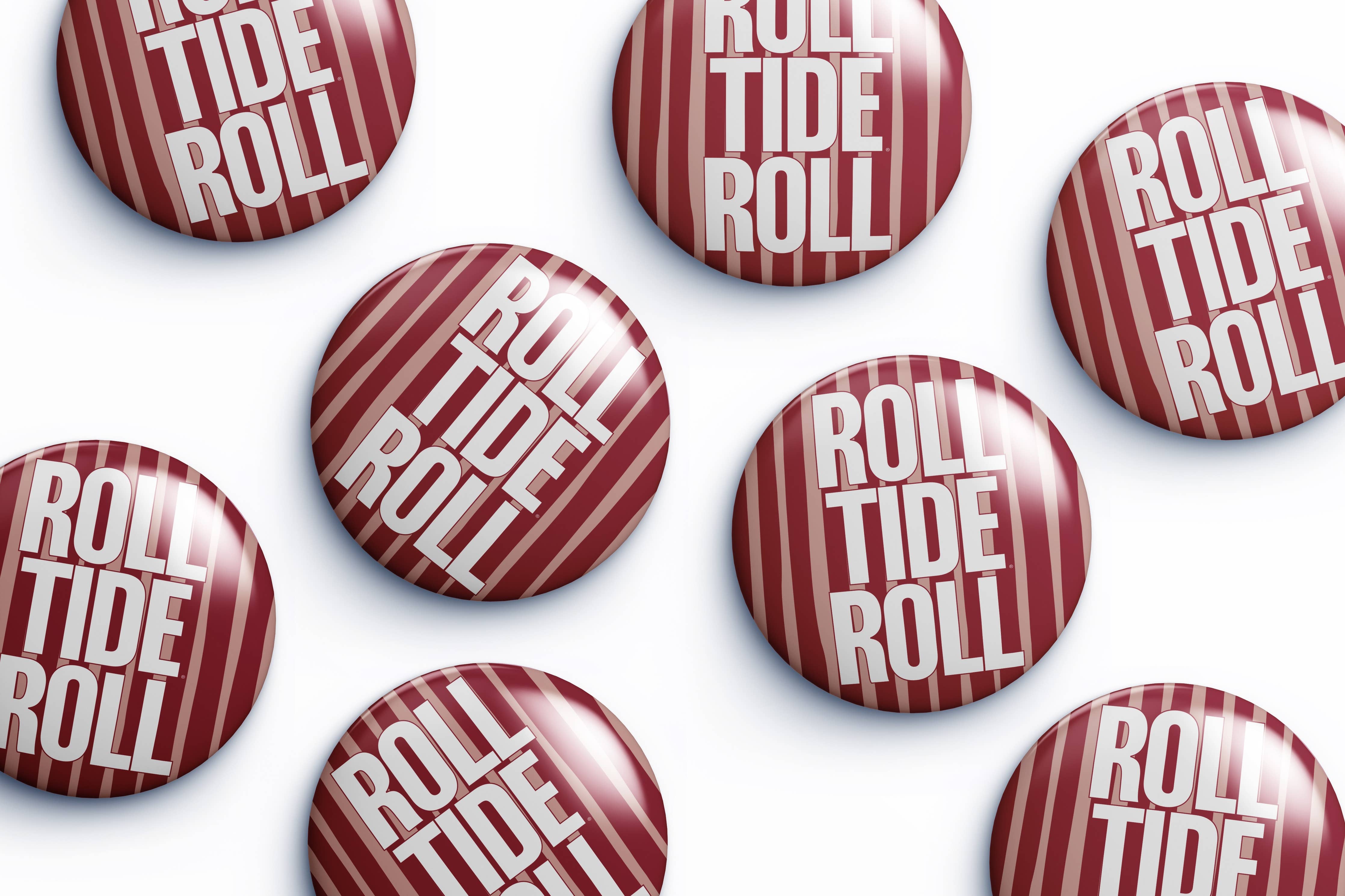 Multiple round pin-back buttons with a glossy finish, featuring a red and white striped candy cane design with the text 'ROLL TIDE ROLL' in white, arranged on a clean white background.