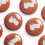 Collection of 'Ready to Roll' buttons with toilet paper graphics on an orange background.
