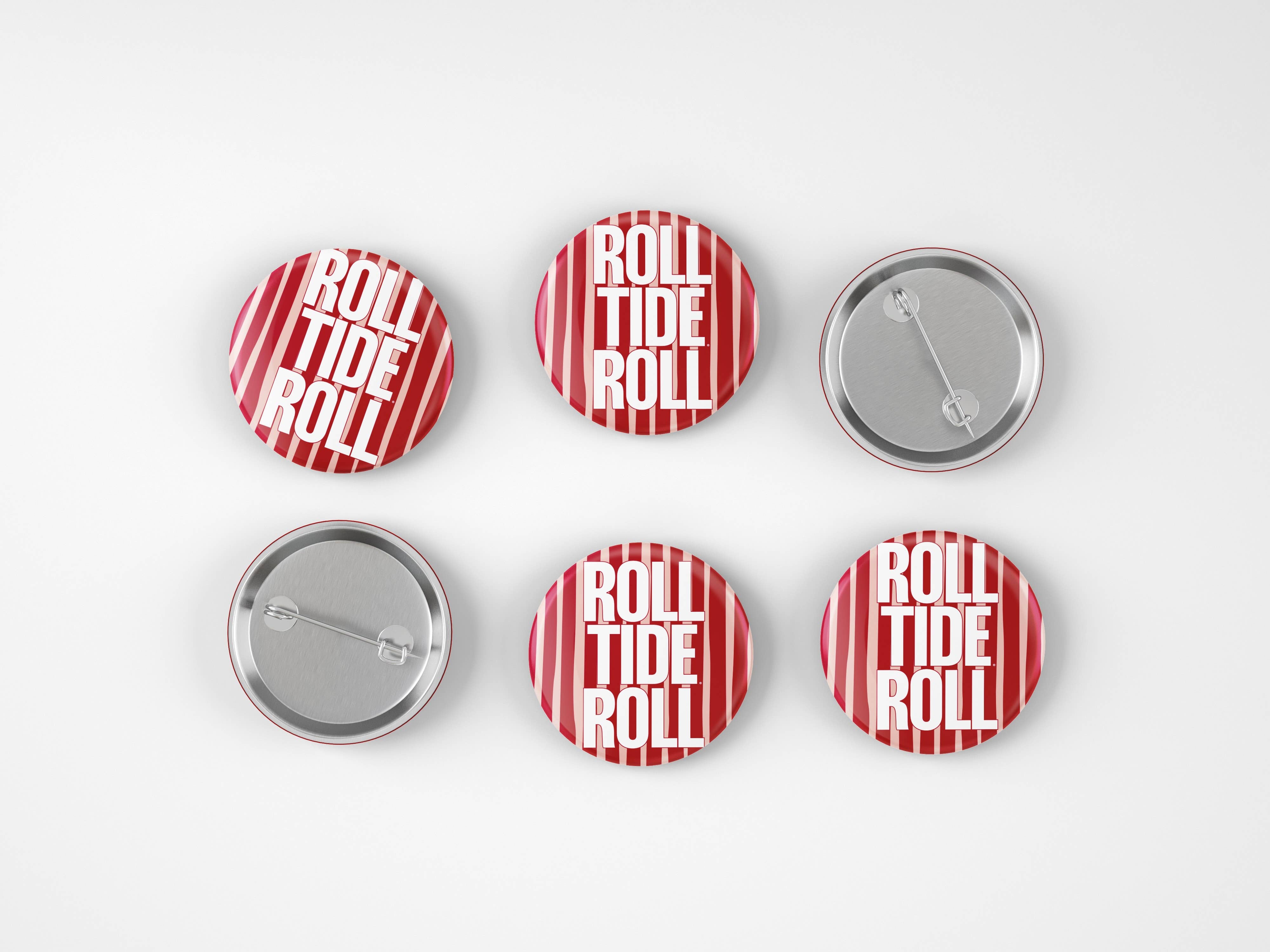 Six round pin-back buttons arranged in two rows on a light gray background. Four buttons show the front design with red and white vertical stripes and the words 'ROLL TIDE ROLL' in white text, and two buttons show the silver metal back with pin fastening.
