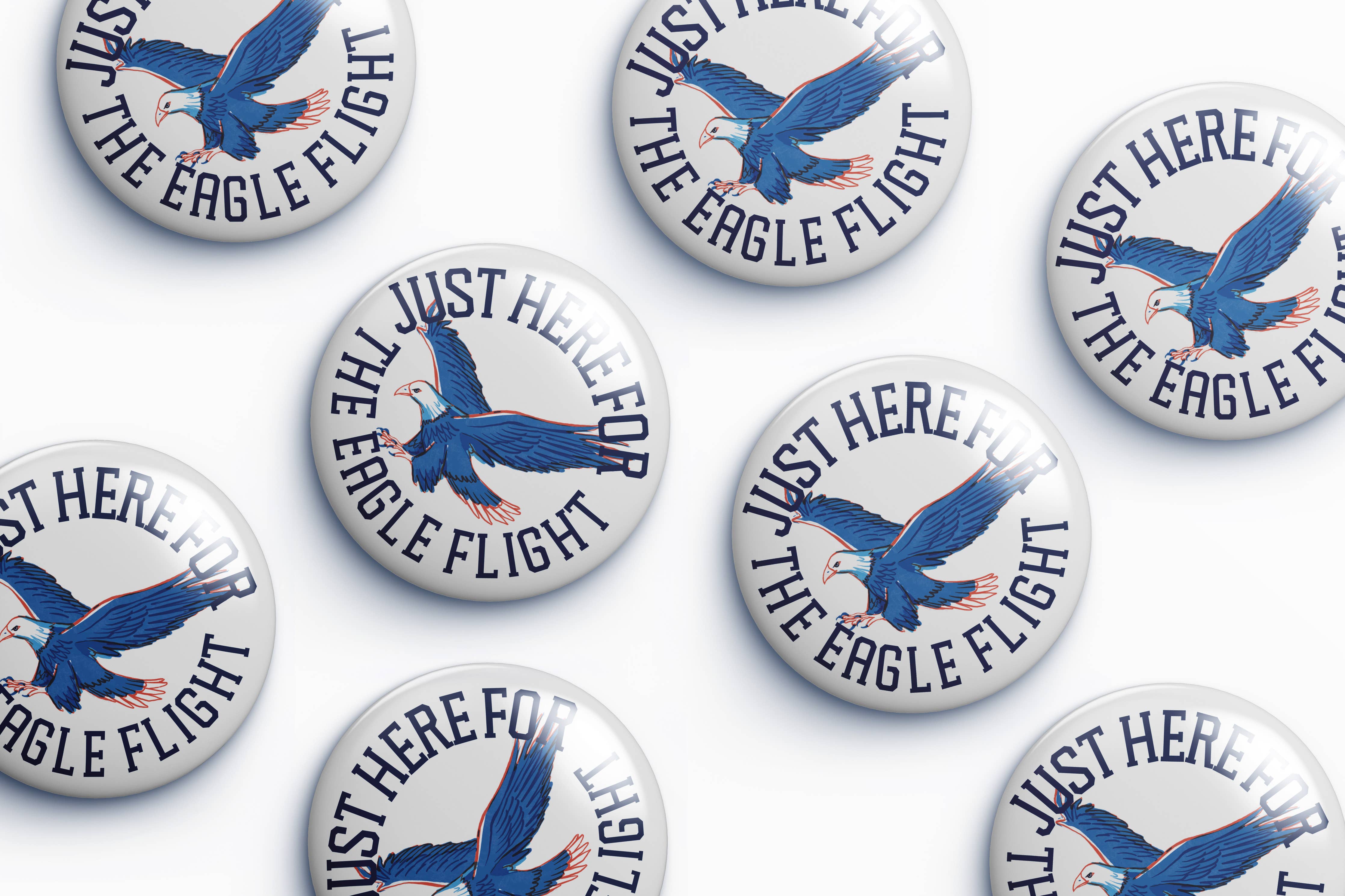 Collection of buttons with an eagle design and text on a white background