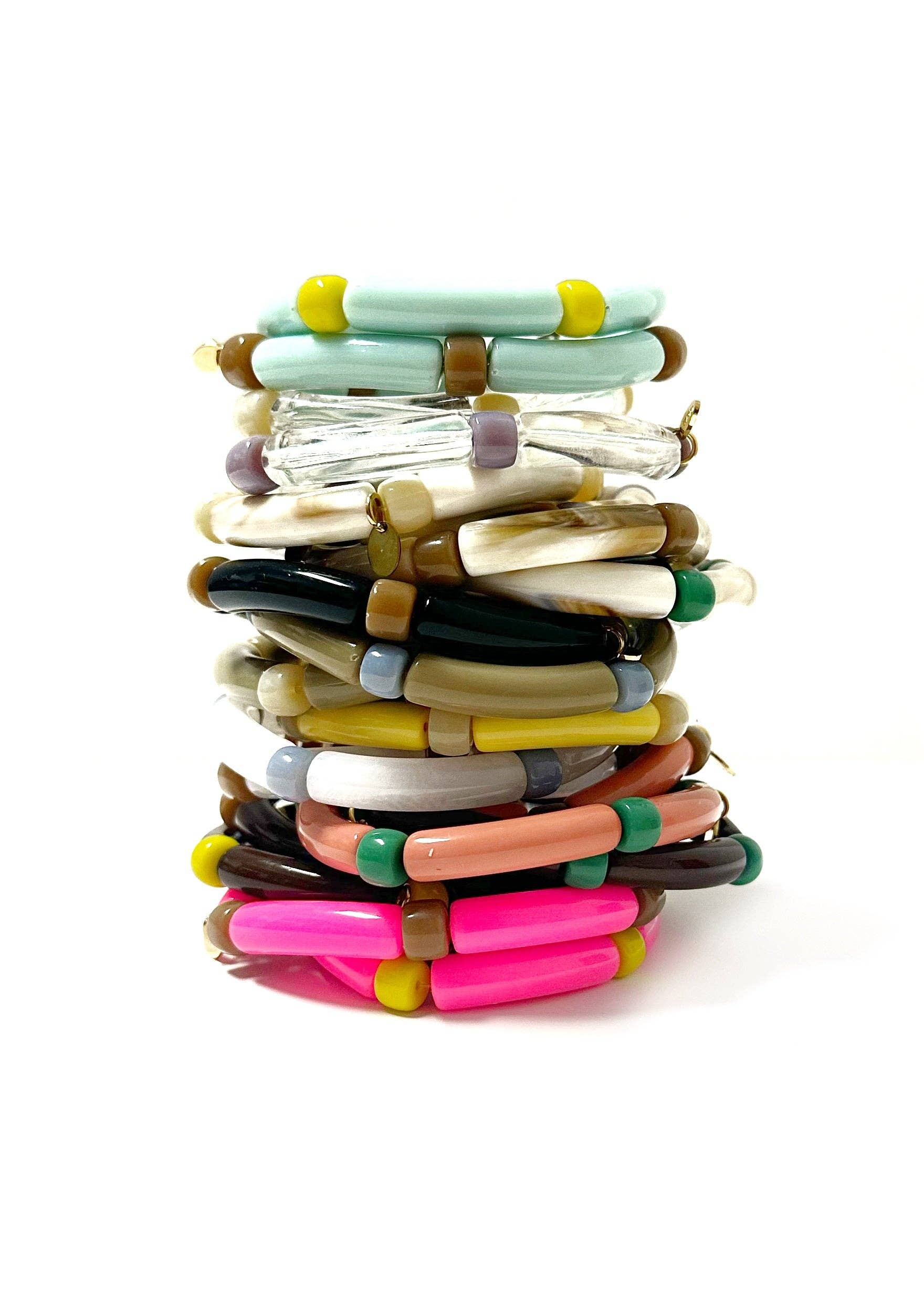 Stack of colorful bangles on a white background