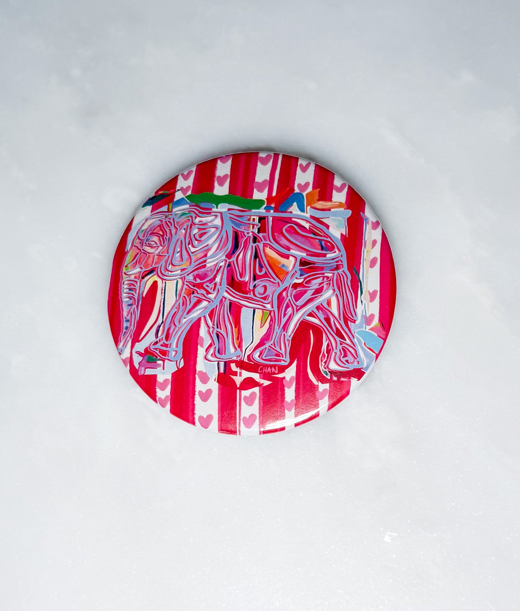 Colorful coaster with elephant design on a white background