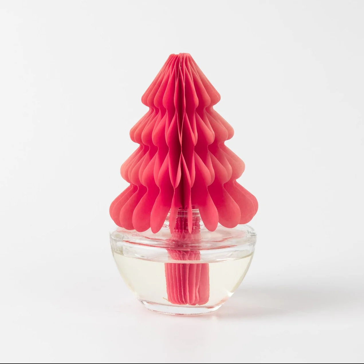 Pink honeycomb-shaped diffuser on a white background