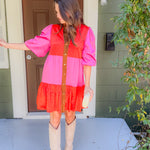 Woman in a two-tone dress standing on a porch