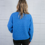Covington Blue Turtleneck Sweater Molly Bracken