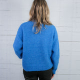 Covington Blue Turtleneck Sweater Molly Bracken