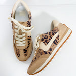 Tan sneakers with leopard print pattern on a white background