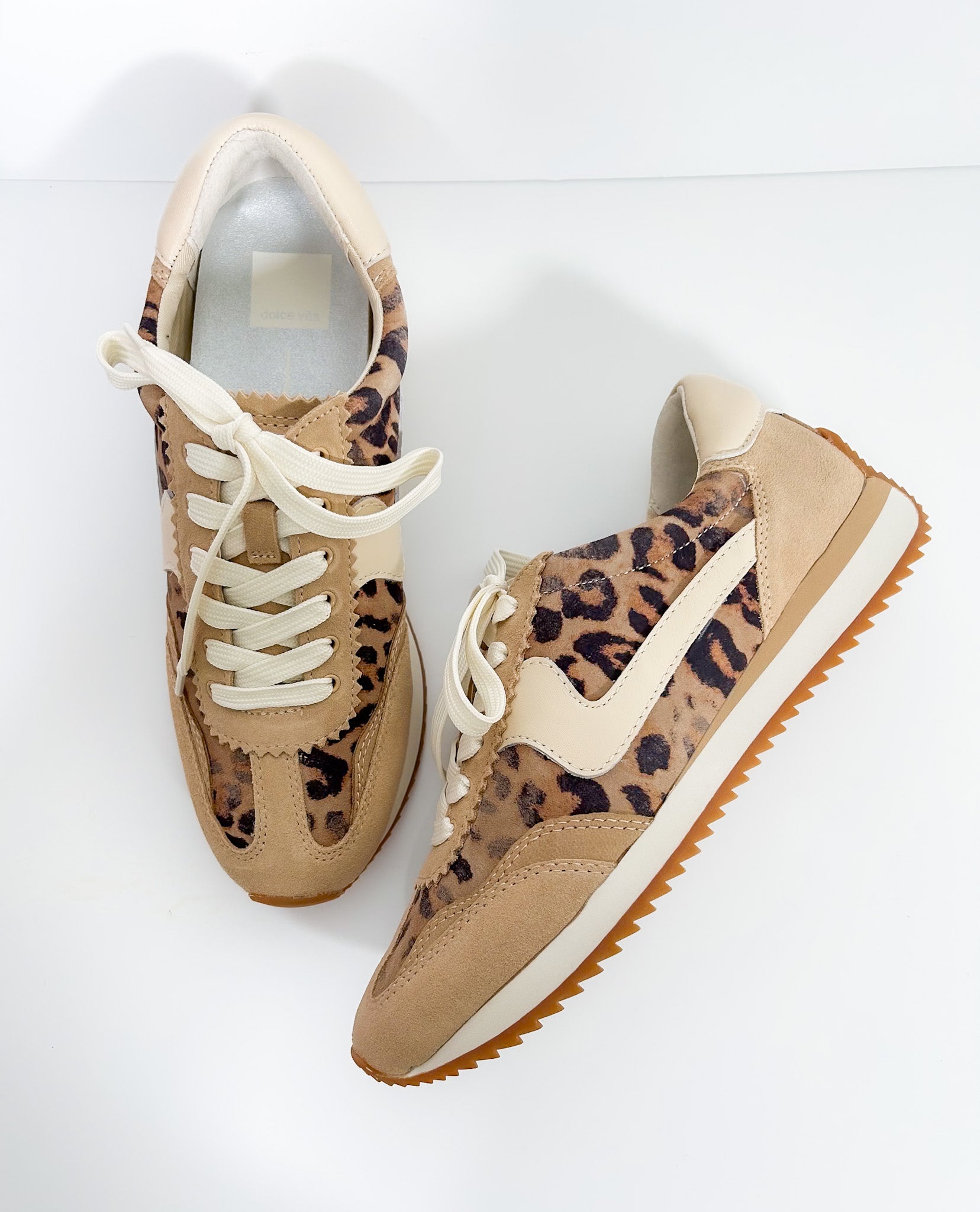Tan sneakers with leopard print pattern on a white background