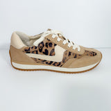 Beige sneaker with leopard print accents on a white background