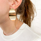 Model in gold earrings