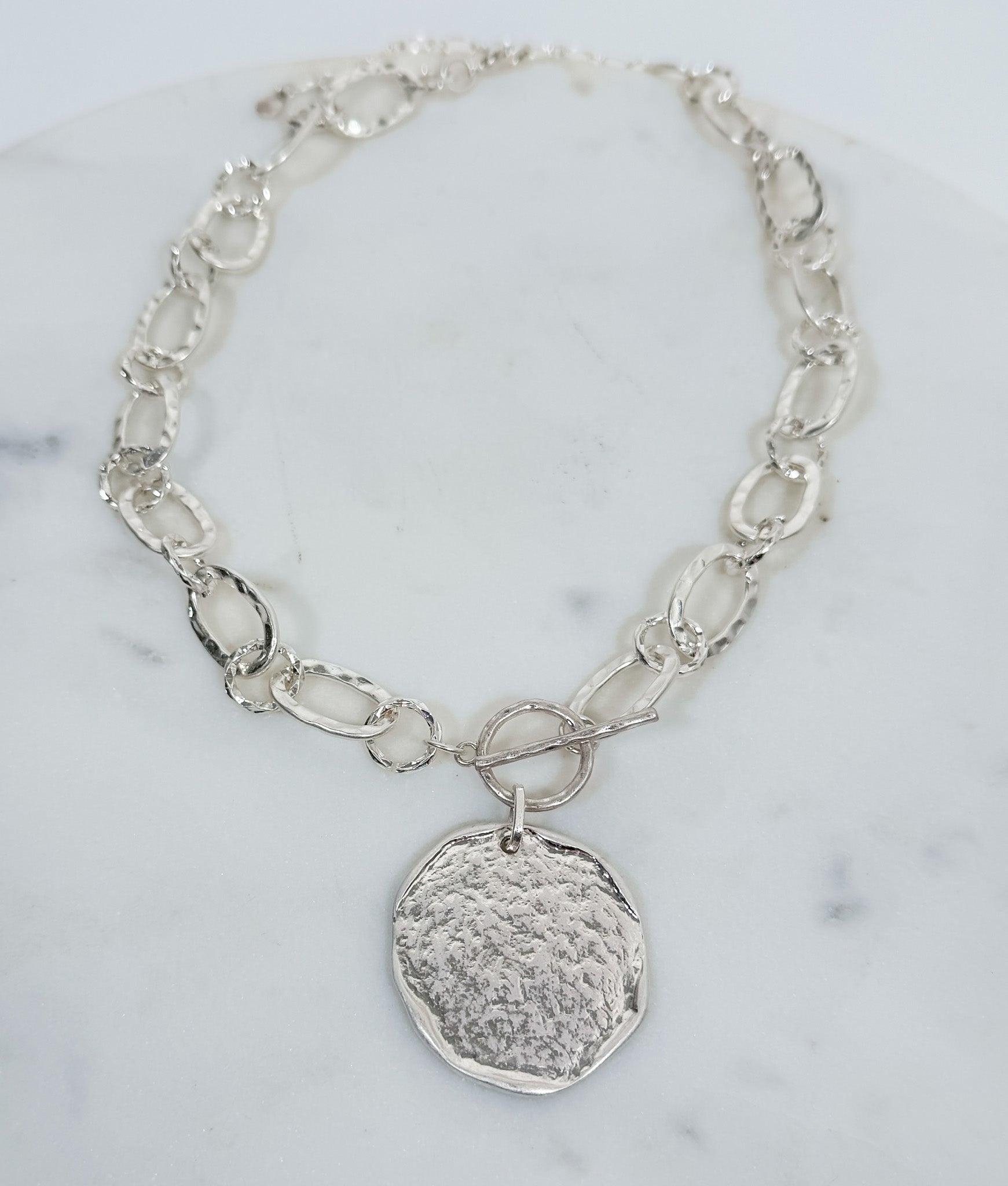 Nomad Glow Front Toggle Hammered Disc Necklace Silver