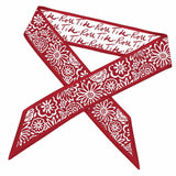 Red bandana with white floral patterns and text on a white background