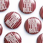 Multiple round pin-back buttons with a glossy finish, featuring a red and white striped candy cane design with the text 'ROLL TIDE ROLL' in white, arranged on a clean white background.