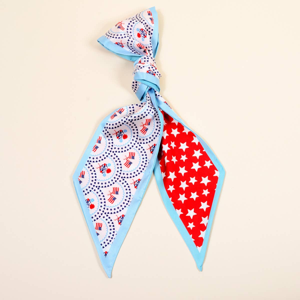 Two square scarves with patriotic patterns on a beige background