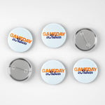 Six round pin-back buttons shown on a light gray background, including three front views and three back views. The front buttons have a white background with orange and blue text reading 'GAMEDAY in Auburn'.