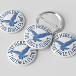 Four circular buttons with an eagle design and text on a gray background