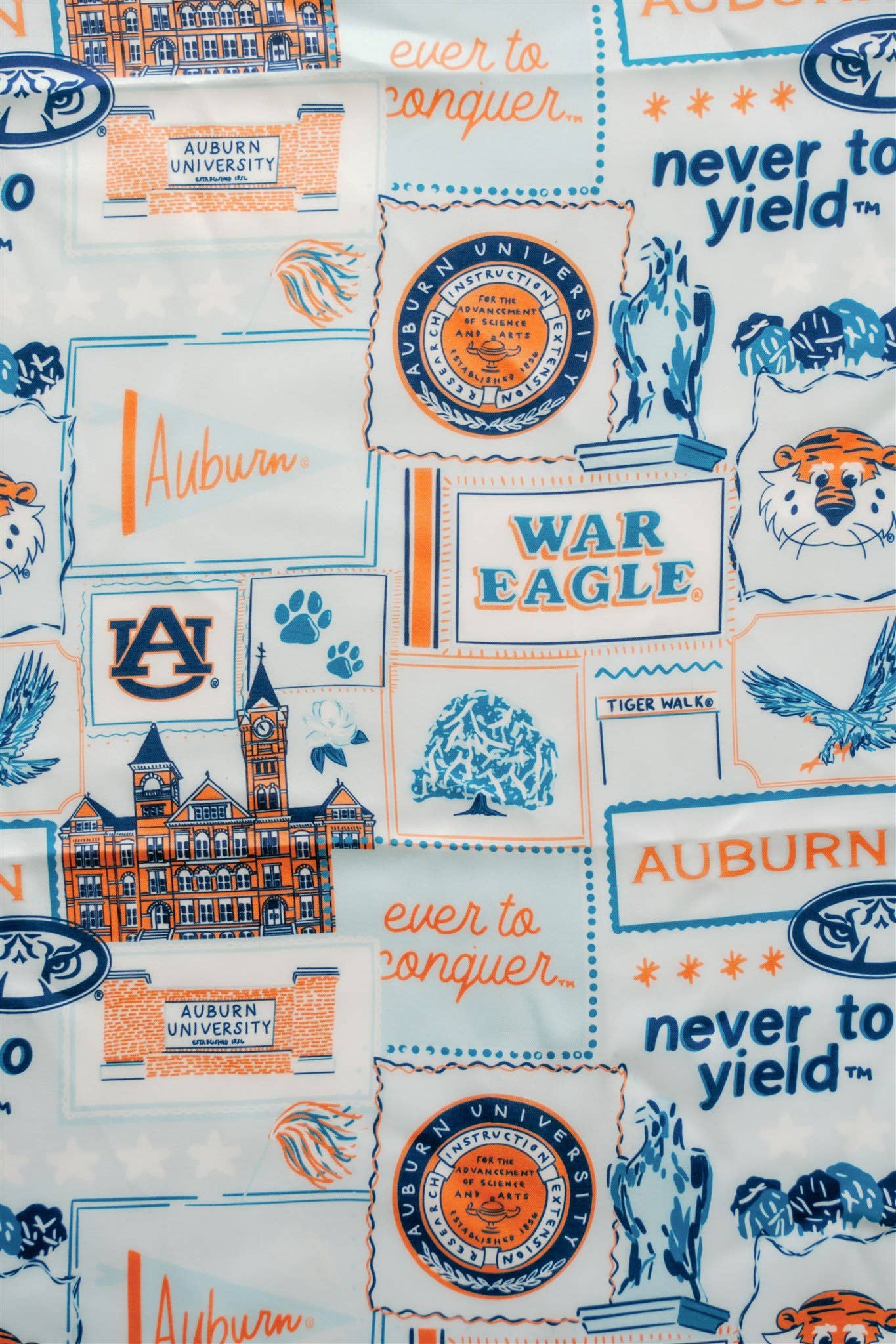 Auburn University-themed fabric with logos, text, and graphics on a white background.