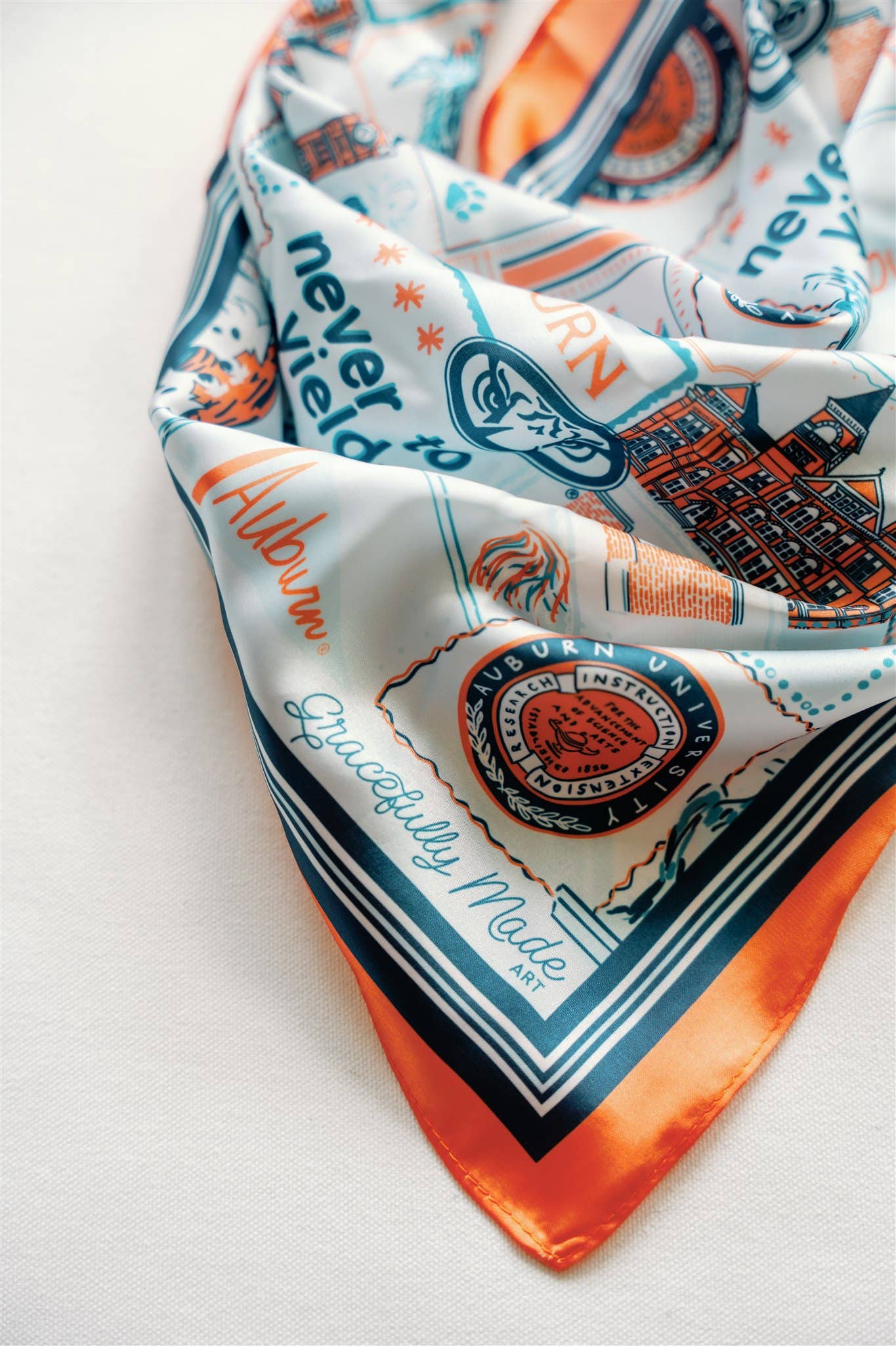 Decorative scarf with text and graphics on a white background
