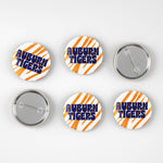 Six round pin-back buttons with Auburn Tigers branding, showing both front and back views on a light gray background.