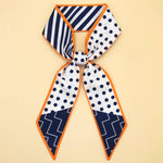 Neckscarf with geometric patterns on a beige background