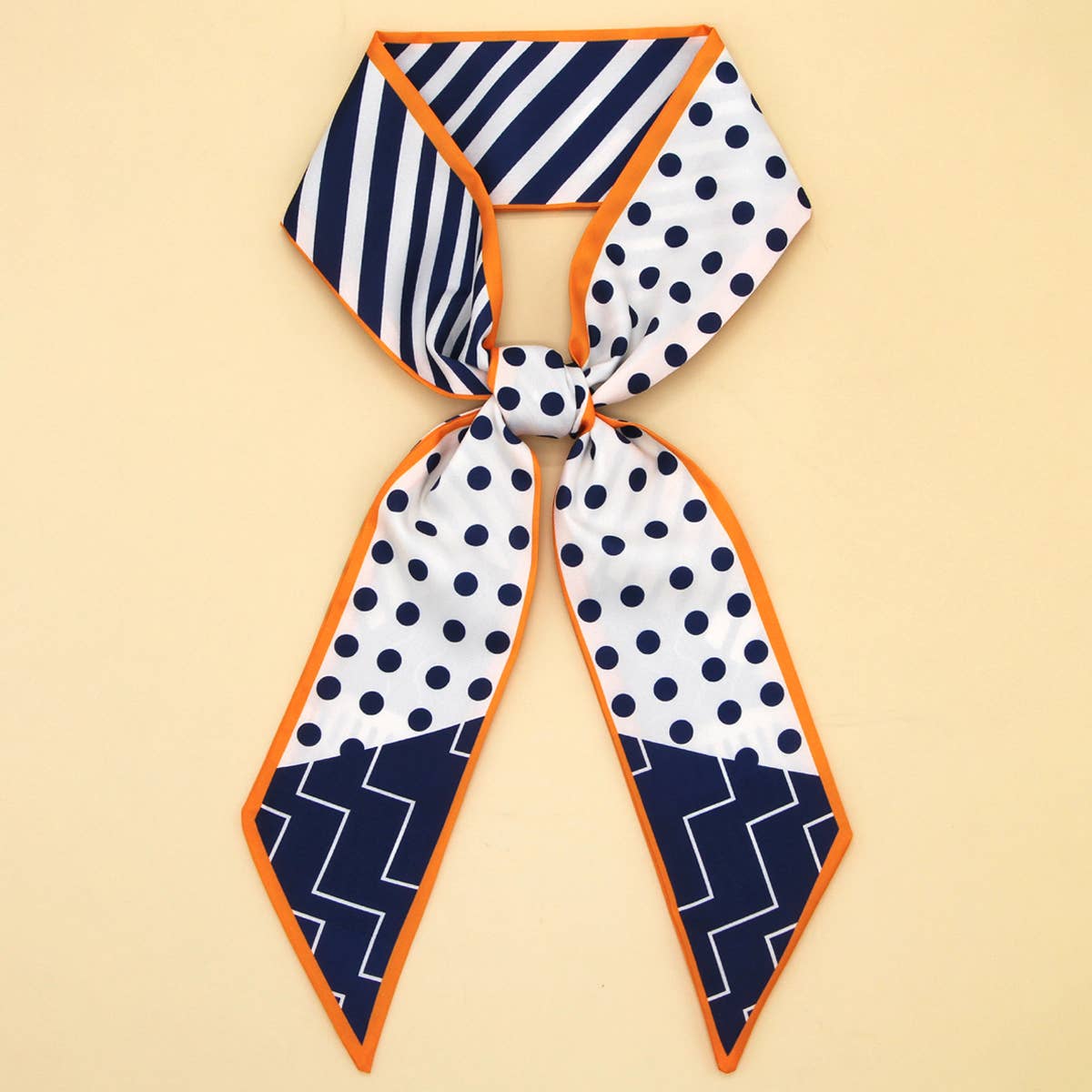 Neckscarf with geometric patterns on a beige background