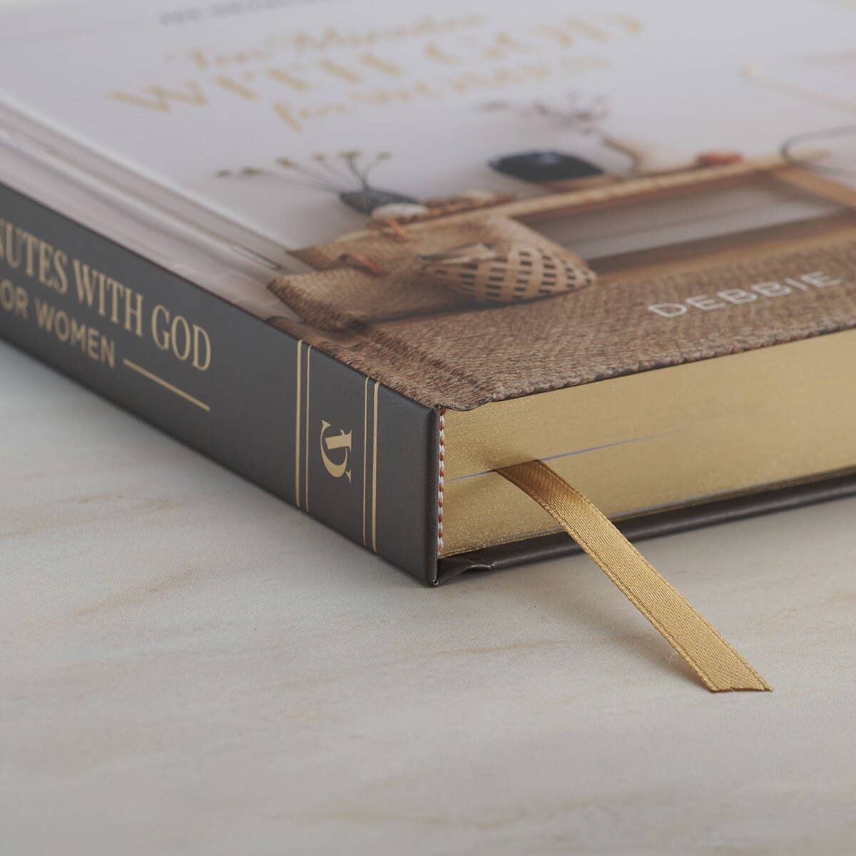 Book with a bookmark on a marble surface