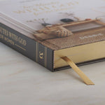 Book with a bookmark on a marble surface