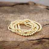 Gold Tone Multi Size Beaded Bracelet Stack - set of 6