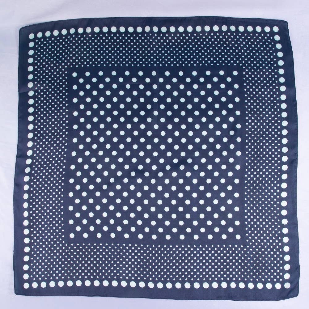 Navy blue square scarf with white polka dots on a white background
