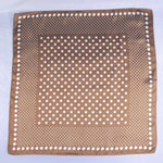 Brown fabric with white polka dot pattern on a white background
