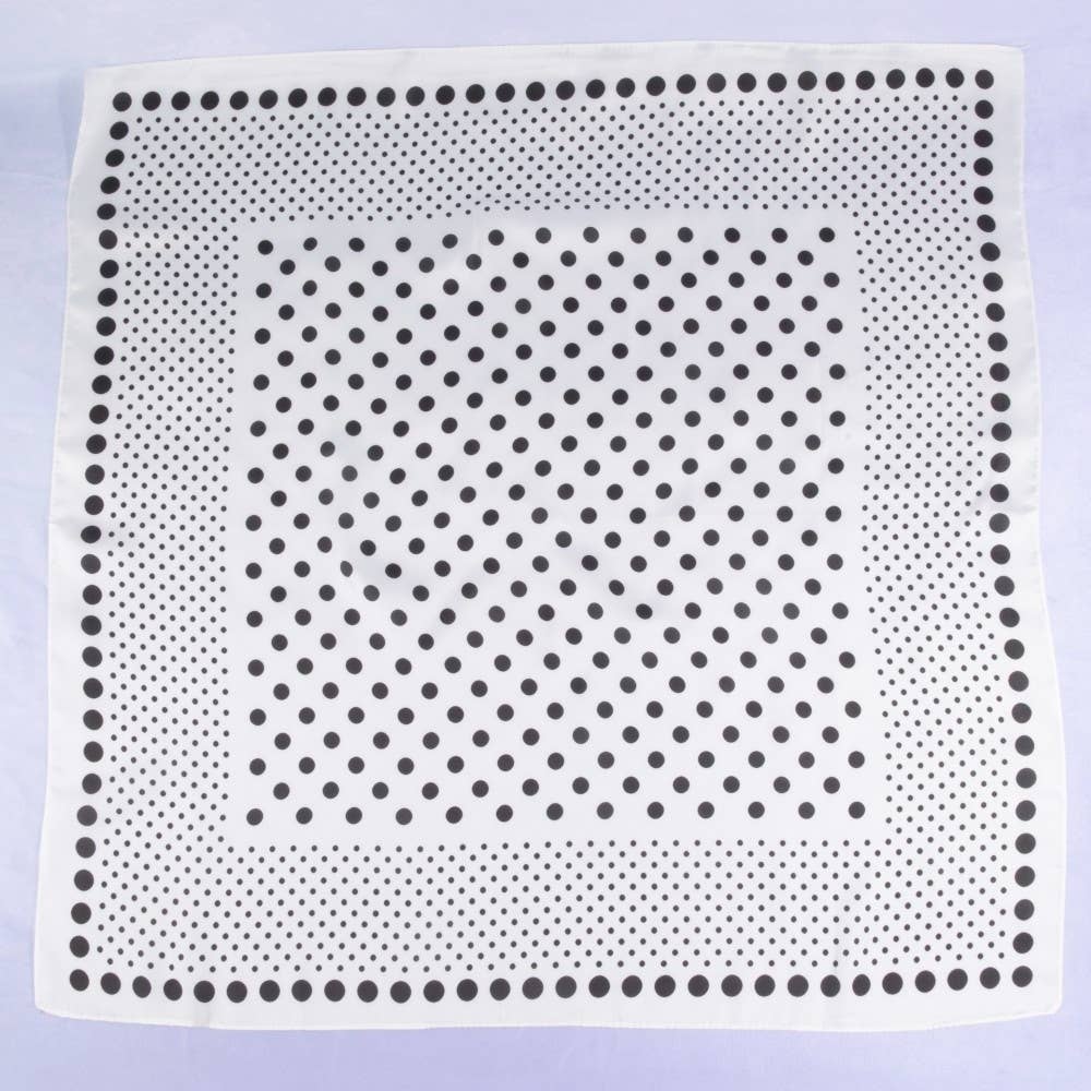 White square with black dot pattern on a light purple background