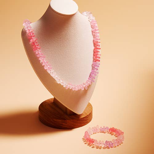 Necklace and bracelet set on a mannequin bust with a beige background