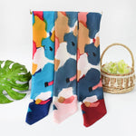Colorful scarf with abstract patterns on a white background