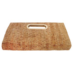 Cork cutting board with a handle on a white background