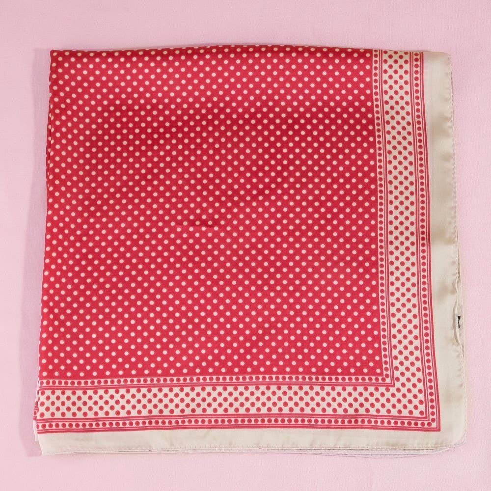 Red polka dot fabric on a pink background