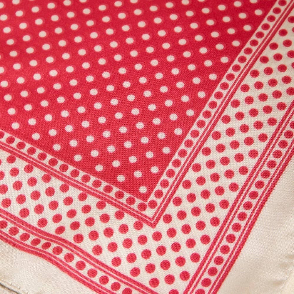 Red and white polka dot fabric with a border