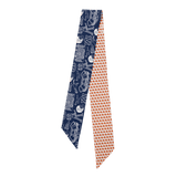 Navy and orange patterned tie on a white background