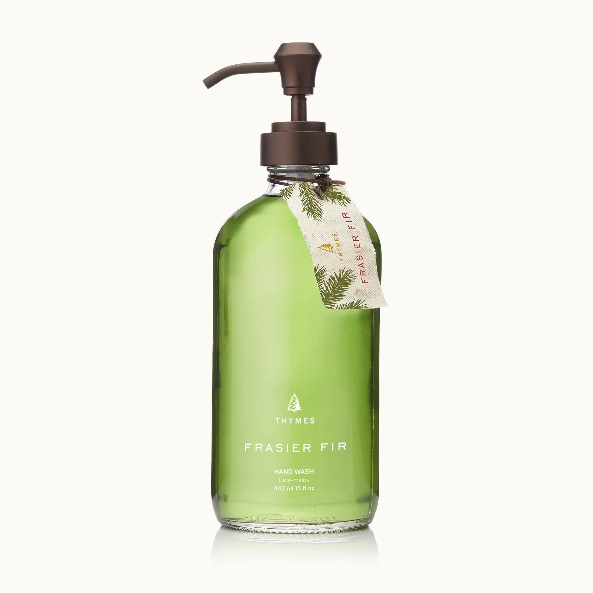 Green bottle of Frasier Fir hand wash with pump on a white background
